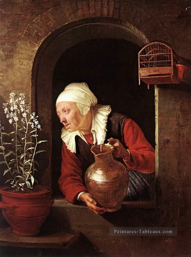 Vieille femme arrosant les fleurs Golden Age Gerrit Dou Peintures à l'huile